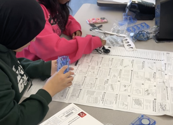 Students building engine kit